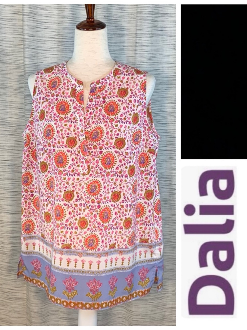 Dalia white base multicolored sleeveless pullover blouse.